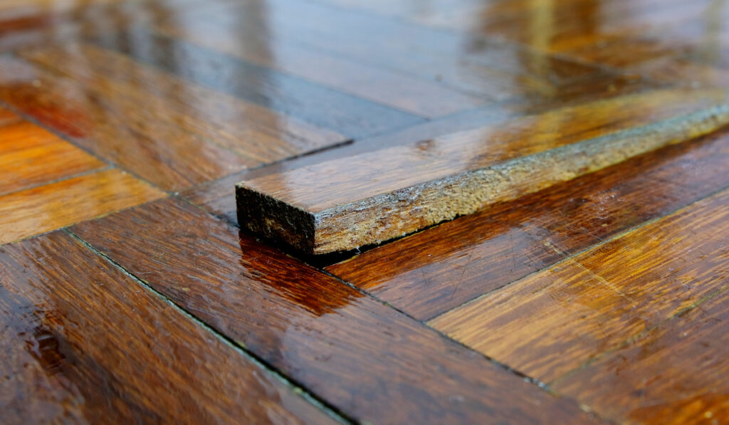 a loose wooden floor tile