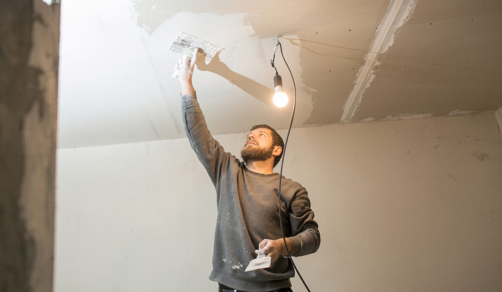 a man applying ceiling plaster