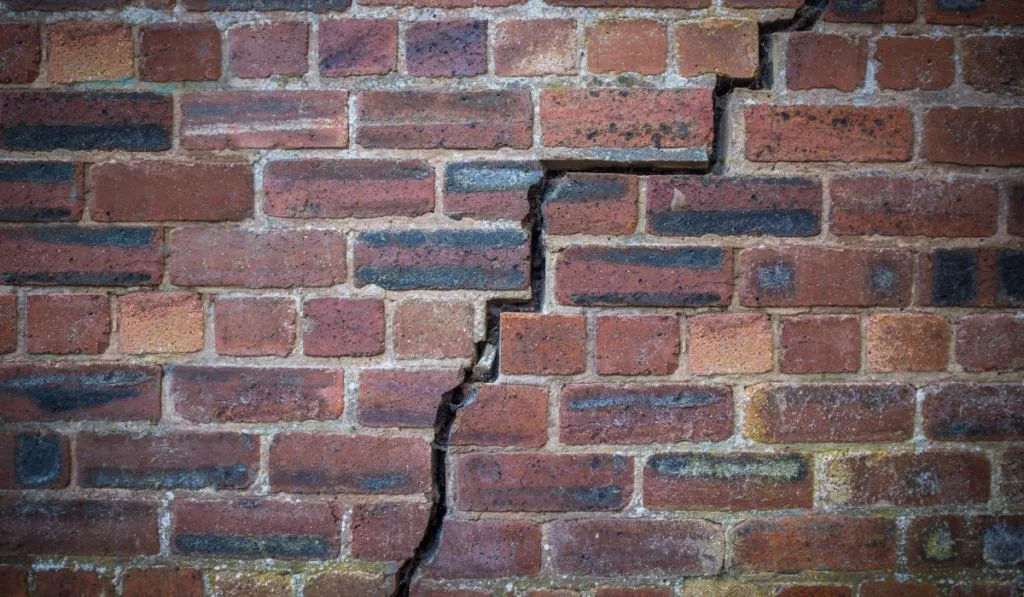 Cracked Red Brick Wall