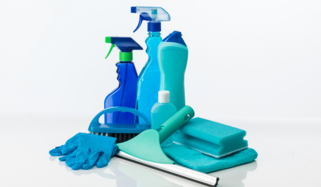blue cleaning tools on white background