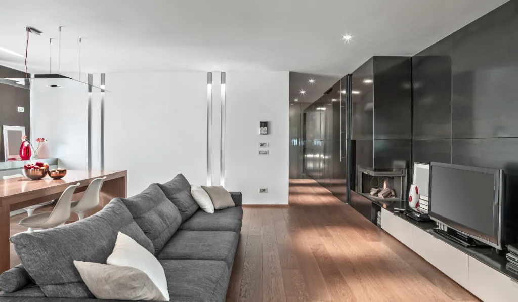 Interiors of a Modern Living Room with Fireplace and Wood Floor