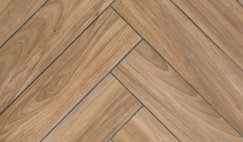 Oak wood texture of floor with tiles immitating hardwood flooring. Traditional herringbone pattern
