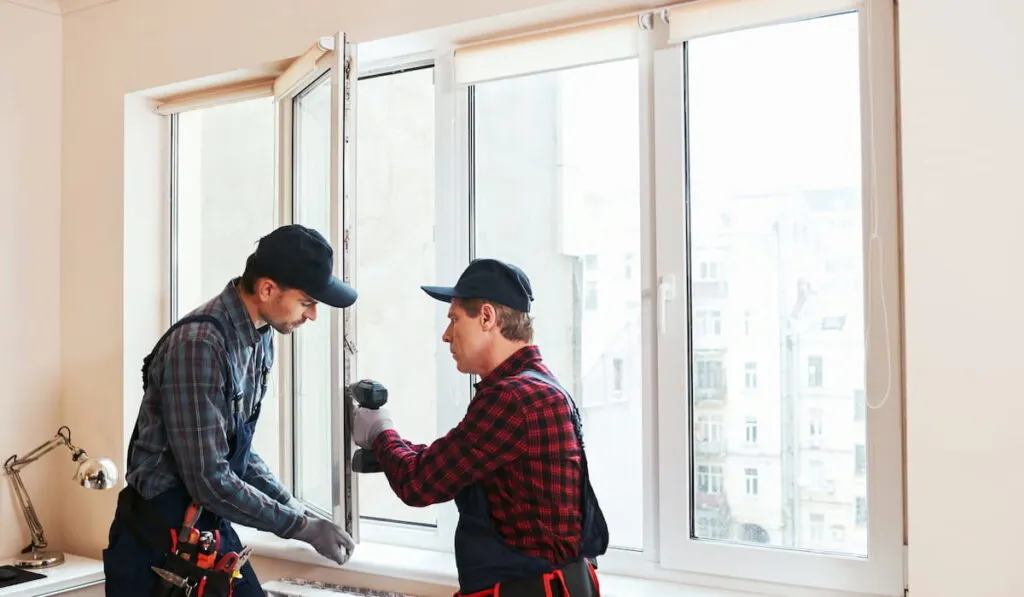 construction workers installing new windows 