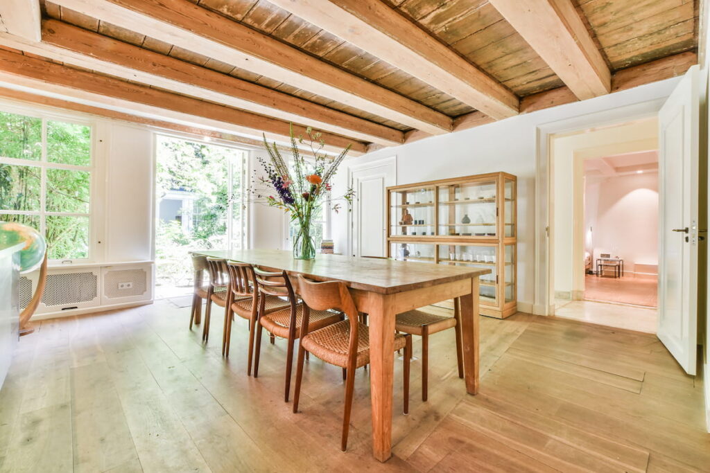 cozy dining room with wooden beams on ceiling