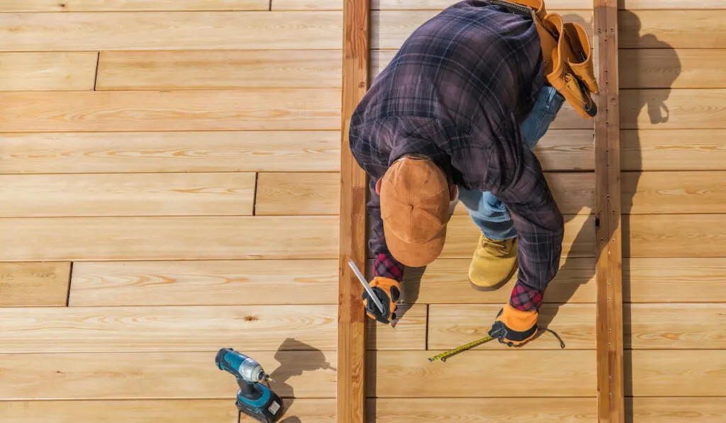 men building wooden deck 