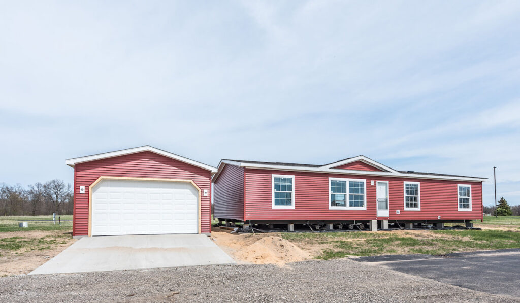 new manufactured home on red vinyl siding 