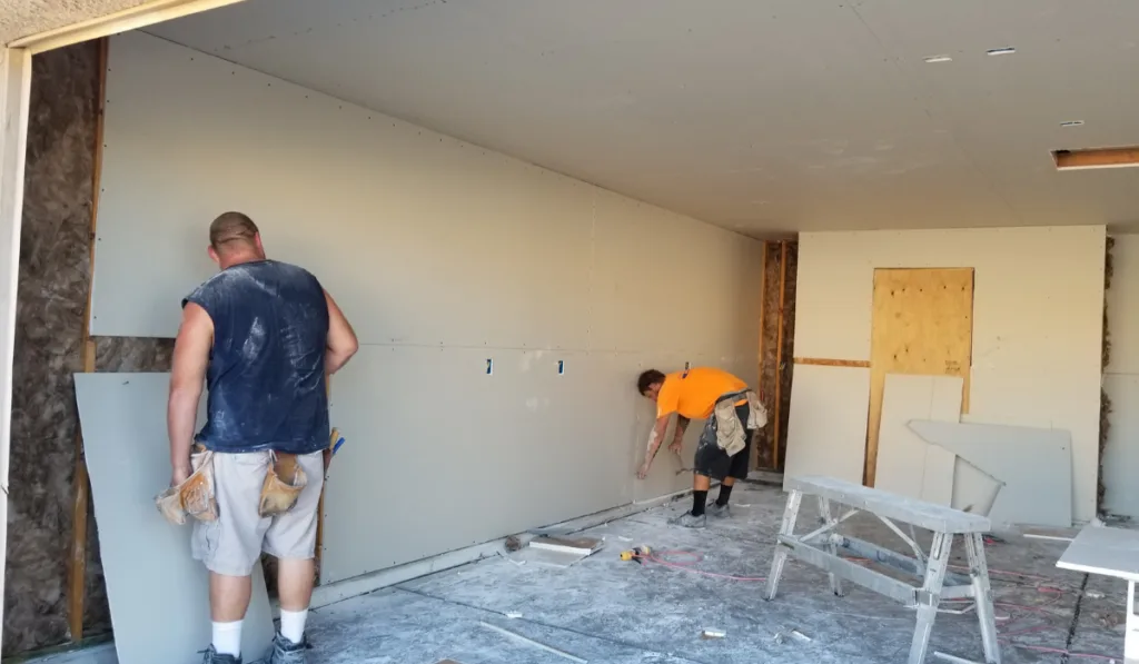 installing new dry wall to repair the garage