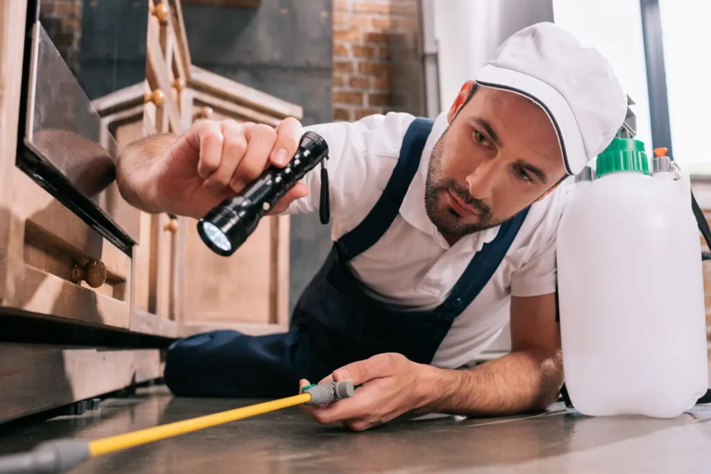 pest control worker lying on floor