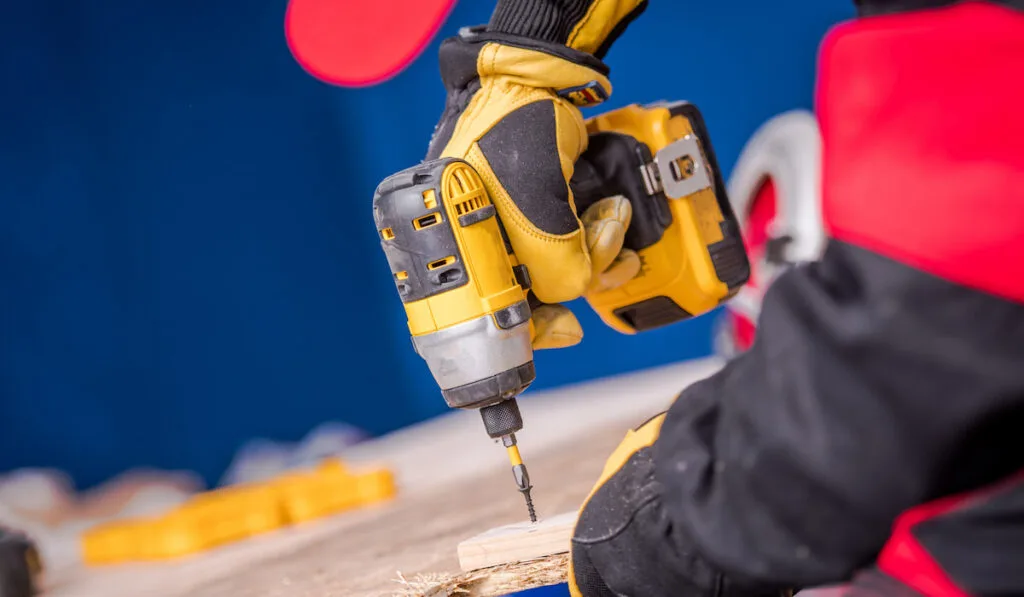 Construction Worker Woodwork with Drill Driver
