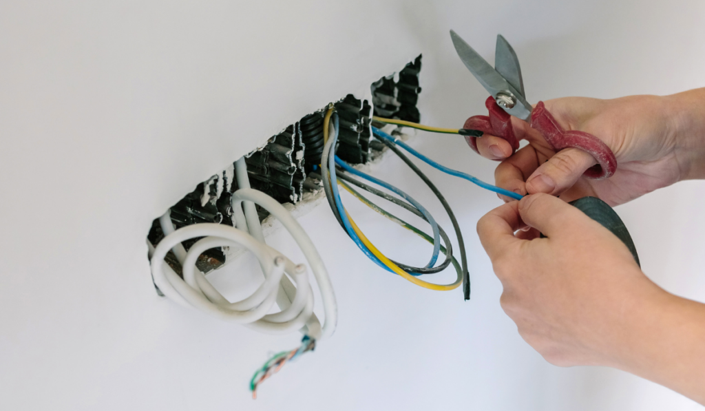 Electrician working on the electrical installation of a house
