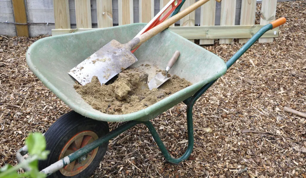 Gardening tools to work in a garden with flat shovel