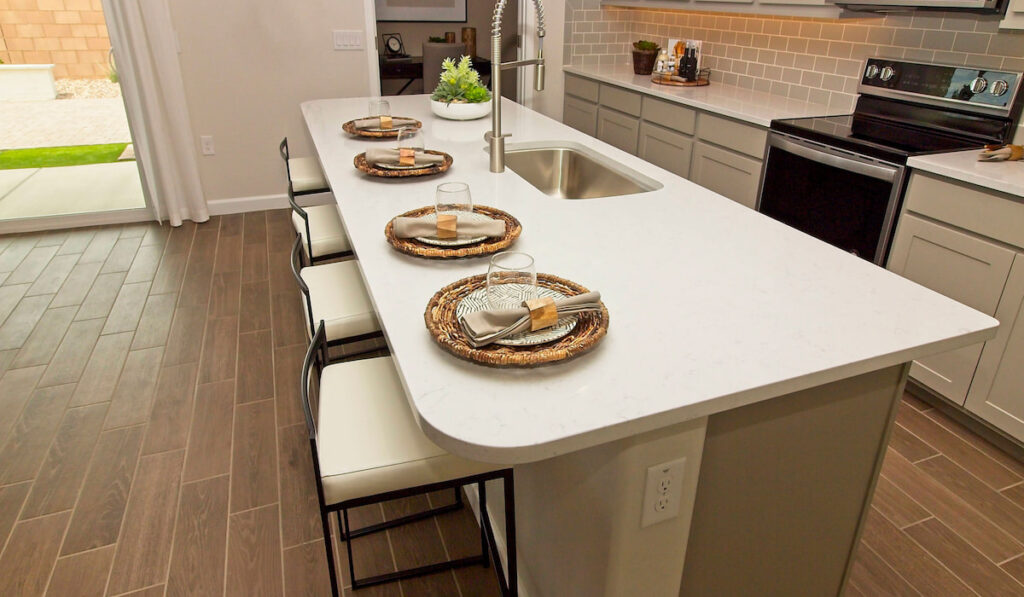 Kitchen Island With Four Place Settings, Stainless Steel Sink and outlet on the side