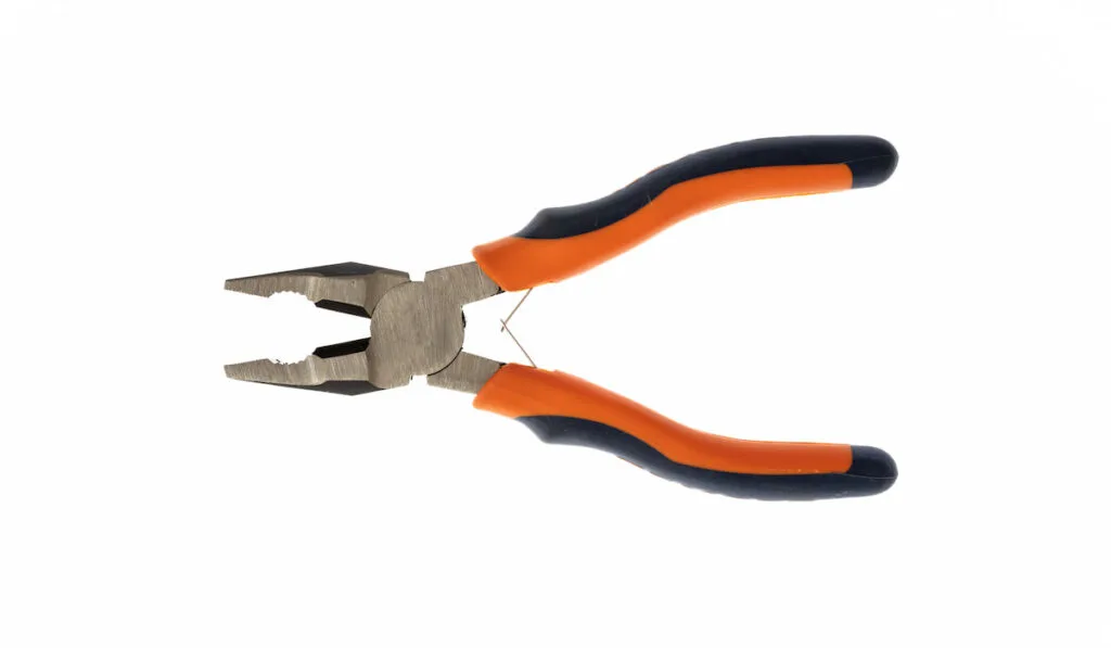 Rubber handle new combination pliers isolated cut out on white background,