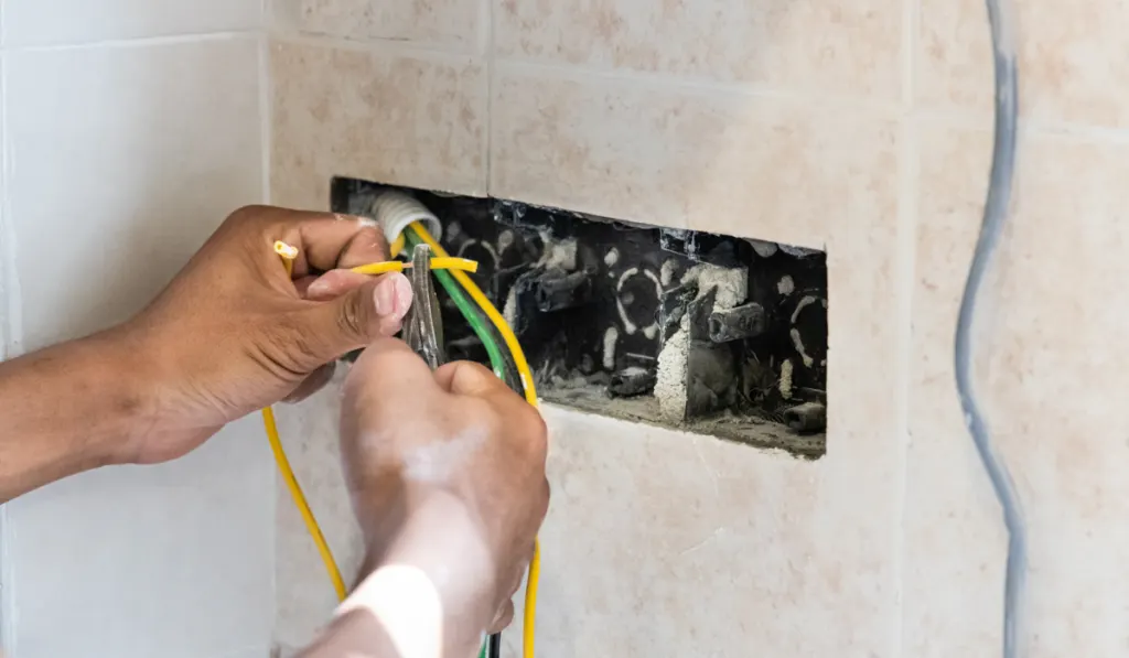 Series of electrician install and mount electrical power socket onto wall