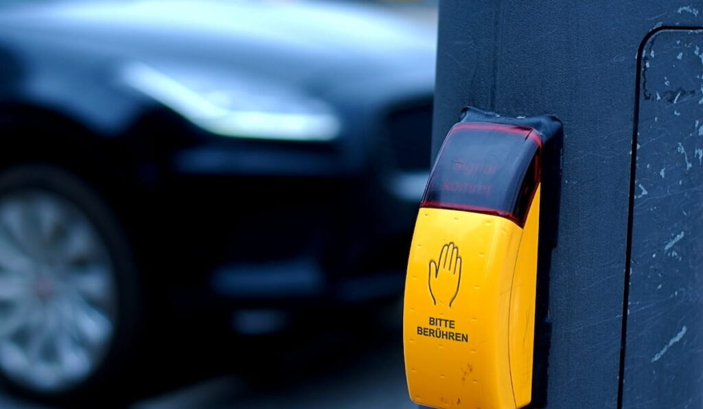  Touch switch for traffic lights on the background of the road