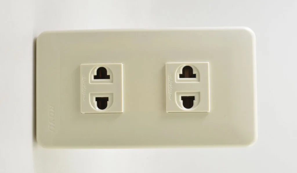 Two slot outlet on white background