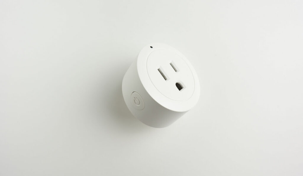 Wireless smart outlet on white background