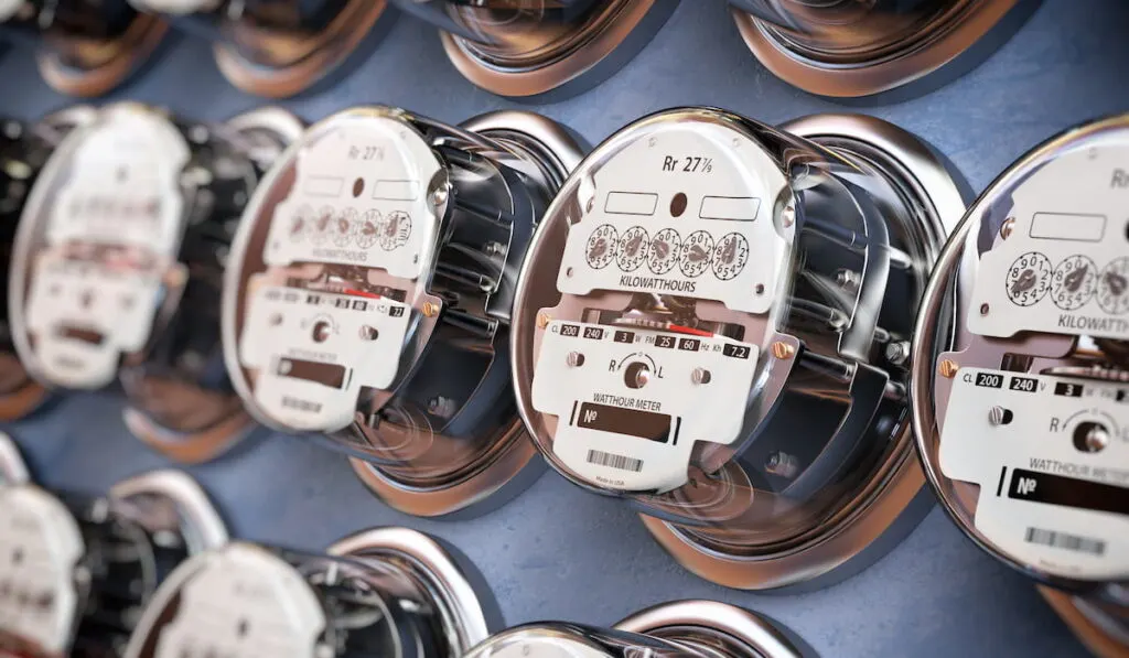 electric meters in a row measuring power use of electricity 