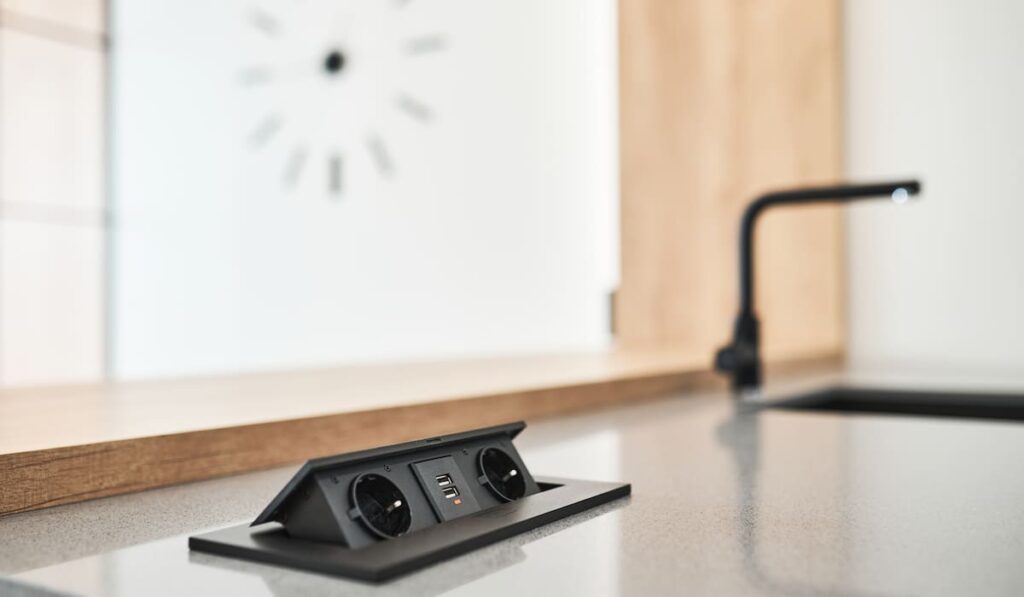 socket on the worktop in the modern kitchen