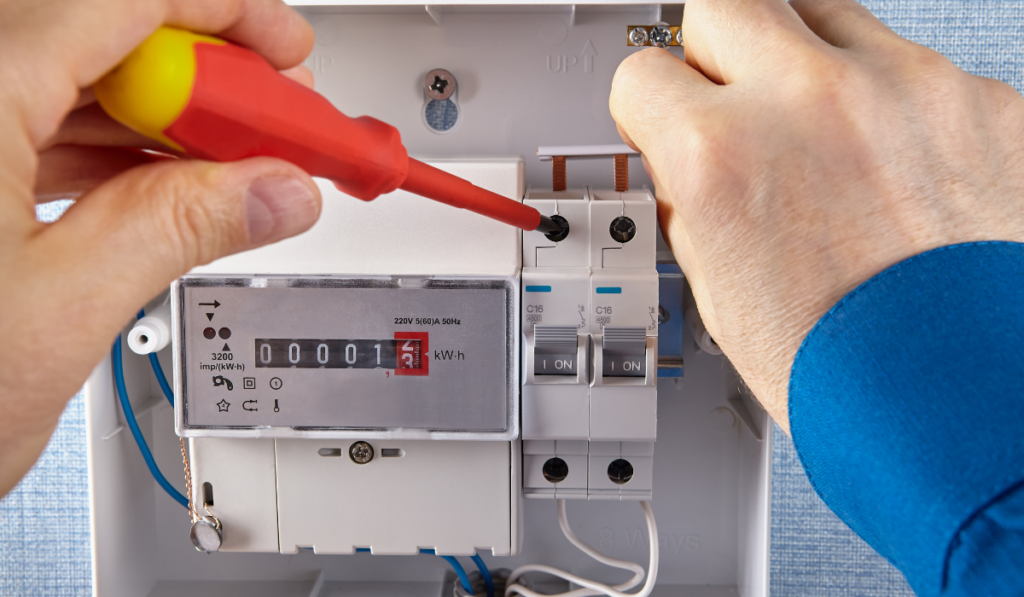 An electrician installs of electrical panel