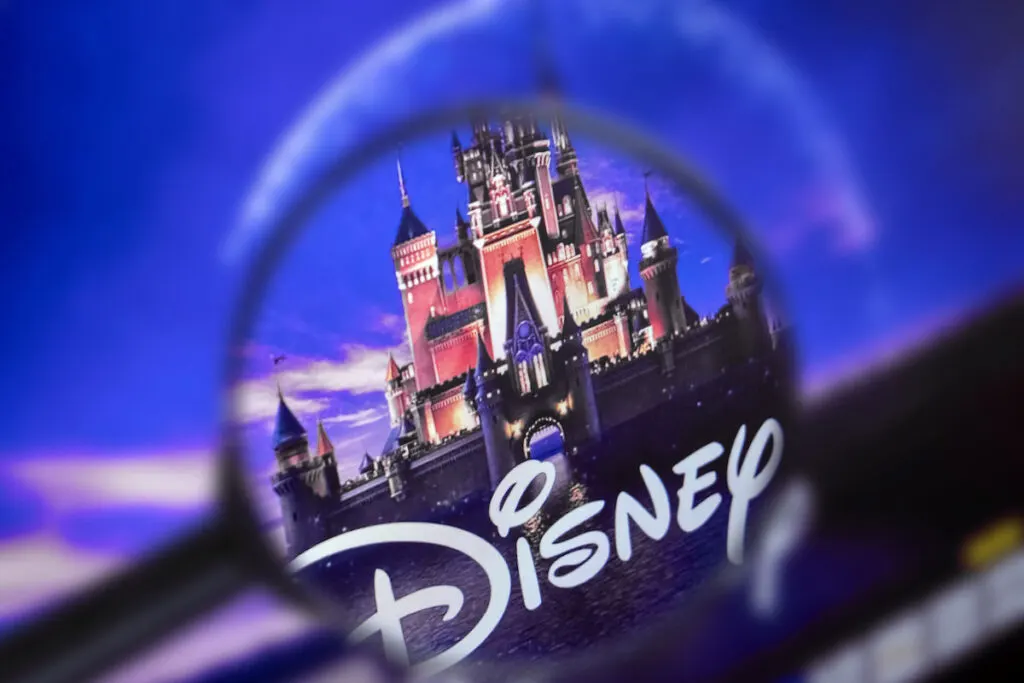 Homepage of Disney site, view through a magnifying glass, Disney logo