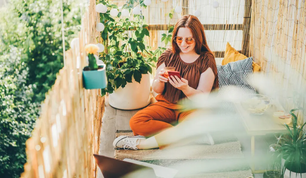 woman relaxing at the balcony