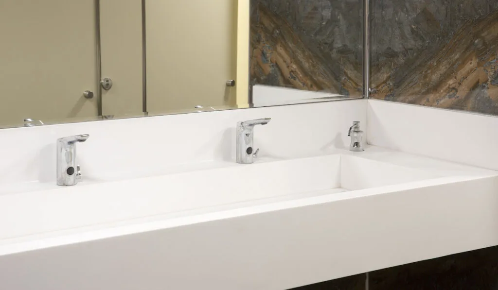 White Corian Sink at Commercial Public Bathroom
