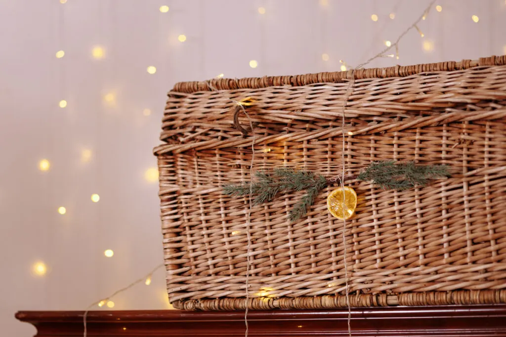 Wicker basket and garlands on top of a cabinet